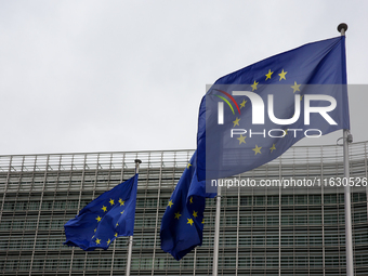 EU flags wave outside the European Commission building in Brussels, Belgium, on September 30, 2024. (