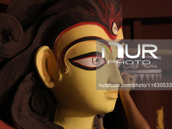 An artisan, Upshona Chatterjee, prepares idols of the Hindu goddess Durga during the auspicious day of Mahalay in a ''pandal'' or temporary...