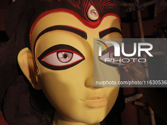 An artisan, Upshona Chatterjee, prepares idols of the Hindu goddess Durga during the auspicious day of Mahalay in a ''pandal'' or temporary...