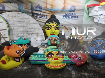 An artisan prepares decoration items to be used for decorating a 'pandal' or temporary platform at a workshop ahead of the Durga Puja festiv...