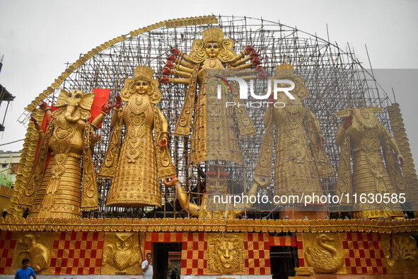 A giant idol of Goddess Durga, towering over 100 ft, is seen at a pandal in Kolkata, India, on October 2, 2024. 