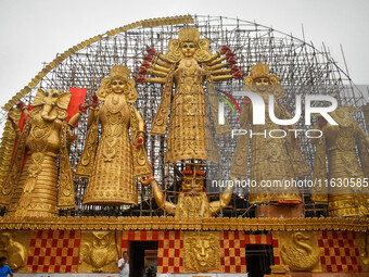 A giant idol of Goddess Durga, towering over 100 ft, is seen at a pandal in Kolkata, India, on October 2, 2024. (