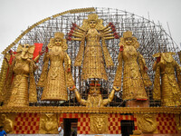 A giant idol of Goddess Durga, towering over 100 ft, is seen at a pandal in Kolkata, India, on October 2, 2024. (