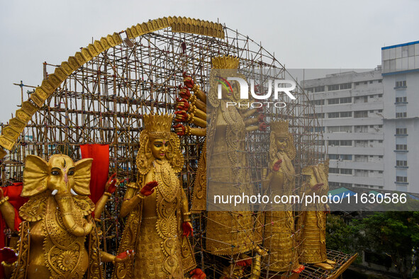 A giant idol of Goddess Durga, towering over 100 ft, is seen at a pandal in Kolkata, India, on October 2, 2024. 