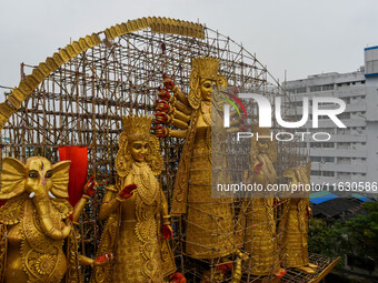 A giant idol of Goddess Durga, towering over 100 ft, is seen at a pandal in Kolkata, India, on October 2, 2024. (