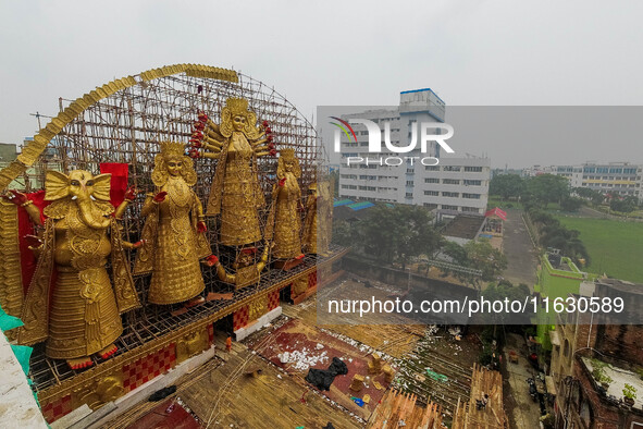 A giant idol of Goddess Durga, towering over 100 ft, is seen at a pandal in Kolkata, India, on October 2, 2024. 