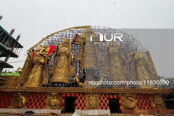 A giant idol of Goddess Durga, towering over 100 ft, is seen at a pandal in Kolkata, India, on October 2, 2024. 