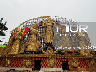 A giant idol of Goddess Durga, towering over 100 ft, is seen at a pandal in Kolkata, India, on October 2, 2024. (