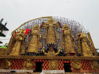 A giant idol of Goddess Durga, towering over 100 ft, is seen at a pandal in Kolkata, India, on October 2, 2024. (