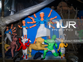 Artisans work on finishing touches of Goddess Durga idols at a workshop in the potter's colony of Tehatta, West Bengal, India, on October 2,...