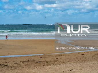 A view of the beach along the Causeway Coast Area in County Antrim, Northern Ireland, on July 2024. (