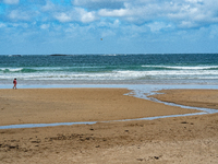 A view of the beach along the Causeway Coast Area in County Antrim, Northern Ireland, on July 2024. (