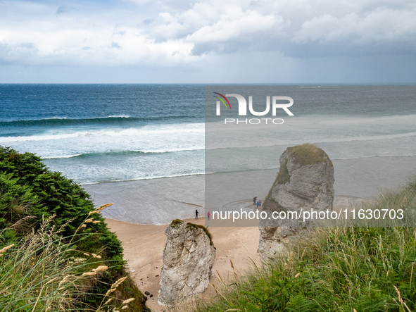 A view of one of the beaches from a cliff along the Causeway Coast Area in County Antrim, Northern Ireland, on July 2024. 