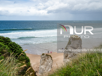 A view of one of the beaches from a cliff along the Causeway Coast Area in County Antrim, Northern Ireland, on July 2024. (