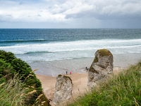 A view of one of the beaches from a cliff along the Causeway Coast Area in County Antrim, Northern Ireland, on July 2024. (