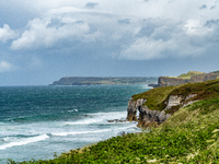 A view of one of the cliffs along the Causeway Coast Area in County Antrim, Northern Ireland, on July 2024. (