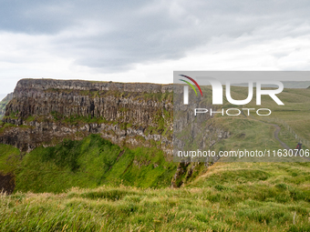 A view of one of the cliffs along the Causeway Coast Area in County Antrim, Northern Ireland, on July 2024. (