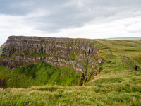 A view of one of the cliffs along the Causeway Coast Area in County Antrim, Northern Ireland, on July 2024. (