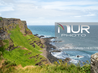 A view of one of the cliffs along the Causeway Coast Area in County Antrim, Northern Ireland, on July 2024. (