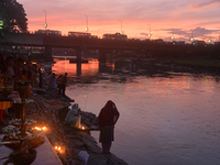 Hindu devotees light diyas on the riverbank of the Mahananda River as part of the prayer of Ganga Aarti and a campaign to save the Mahananda...