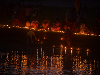 Hindu devotees light diyas on the riverbank of the Mahananda River as part of the prayer of Ganga Aarti and a campaign to save the Mahananda...