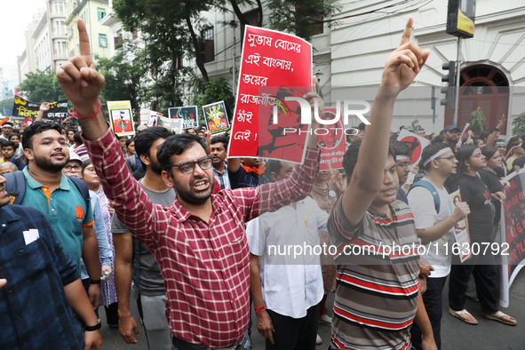 Doctors and citizens hold placards and shout slogans during a protest march against the rape and murder of a PGT woman doctor at Government-...