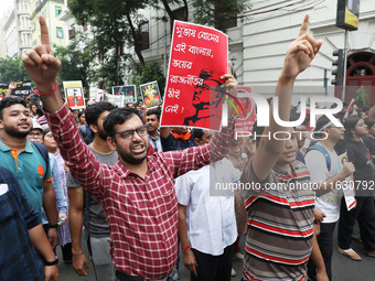 Doctors and citizens hold placards and shout slogans during a protest march against the rape and murder of a PGT woman doctor at Government-...