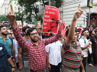 Doctors and citizens hold placards and shout slogans during a protest march against the rape and murder of a PGT woman doctor at Government-...