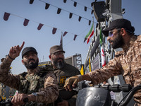 Islamic Revolutionary Guard Corps' (IRGC) special forces talk to each other while monitoring an area before the beginning of a gathering mar...