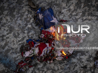 A burnt U.S. flag is pictured during a gathering marking the memory of Lebanon's Hezbollah Secretary General Hassan Nasrallah and an Iranian...