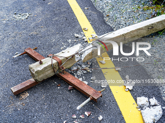 Due to heavy rainfall, the landslide causes many electric line poles to collapse in Sisneri village, Makwanpur, Nepal, on October 2, 2024. (