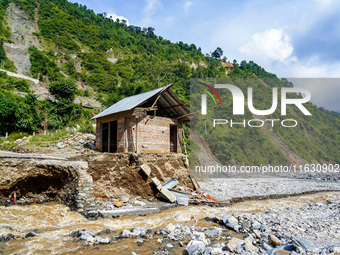 The flooding of the Kulekhani River damages homes and riverbanks in Sisneri, Makwanpur, Nepal, on October 2, 2024. Thirty-one homes are comp...