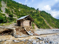 The flooding of the Kulekhani River damages homes and riverbanks in Sisneri, Makwanpur, Nepal, on October 2, 2024. Thirty-one homes are comp...