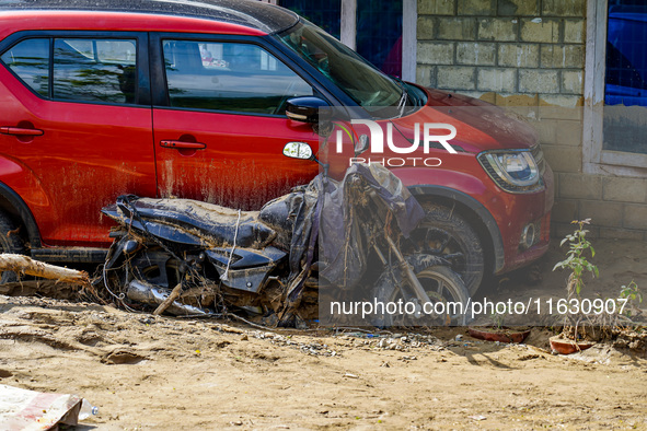 The flooding of the Kulekhani River damages homes and vehicles in Sisneri, Makwanpur, Nepal, on October 2, 2024. 