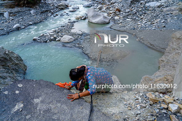 Due to heavy rainfall, the Kulekhani River flood damages the Dakshinkali-Sisneri road in Sisneri, Makwanpur, Nepal, on October 2, 2024. Peop...