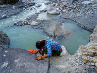 Due to heavy rainfall, the Kulekhani River flood damages the Dakshinkali-Sisneri road in Sisneri, Makwanpur, Nepal, on October 2, 2024. Peop...