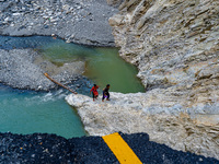 Due to heavy rainfall, the Kulekhani River flood damages the Dakshinkali-Sisneri road in Sisneri, Makwanpur, Nepal, on October 2, 2024. Peop...