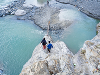 Due to heavy rainfall, the Kulekhani River flood damages the Dakshinkali-Sisneri road in Sisneri, Makwanpur, Nepal, on October 2, 2024. Peop...