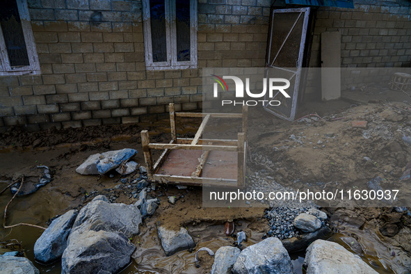 The flooding of the Kulekhani River damages homes and vehicles in Sisneri, Makwanpur, Nepal, on October 2, 2024. Thirty-one homes are comple...