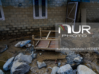 The flooding of the Kulekhani River damages homes and vehicles in Sisneri, Makwanpur, Nepal, on October 2, 2024. Thirty-one homes are comple...