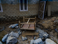 The flooding of the Kulekhani River damages homes and vehicles in Sisneri, Makwanpur, Nepal, on October 2, 2024. Thirty-one homes are comple...