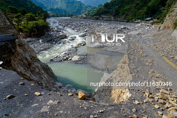 Due to heavy rainfall, the Kulekhani River flood damages the Dakshinkali-Sisneri road in Sisneri, Makwanpur, Nepal, on October 2, 2024. 