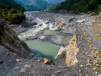 Due to heavy rainfall, the Kulekhani River flood damages the Dakshinkali-Sisneri road in Sisneri, Makwanpur, Nepal, on October 2, 2024. (