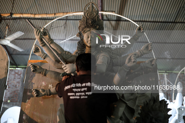 Artisans make idols ahead of Durga Puja in Dhaka, Bangladesh, on October 2, 2024. 