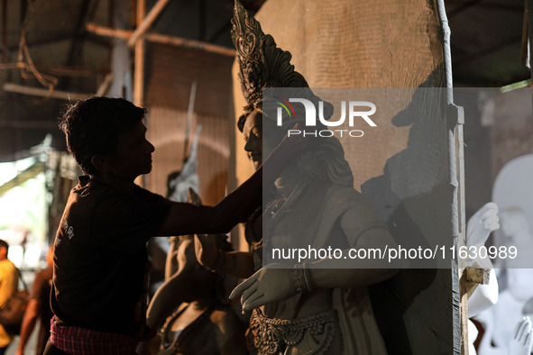 Artisans make idols ahead of Durga Puja in Dhaka, Bangladesh, on October 2, 2024. 