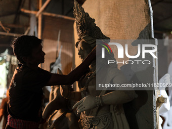 Artisans make idols ahead of Durga Puja in Dhaka, Bangladesh, on October 2, 2024. (