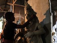 Artisans make idols ahead of Durga Puja in Dhaka, Bangladesh, on October 2, 2024. (