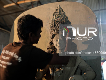 Artisans make idols ahead of Durga Puja in Dhaka, Bangladesh, on October 2, 2024. (