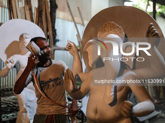 Artisans make idols ahead of Durga Puja in Dhaka, Bangladesh, on October 2, 2024. (