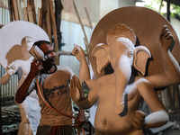 Artisans make idols ahead of Durga Puja in Dhaka, Bangladesh, on October 2, 2024. (